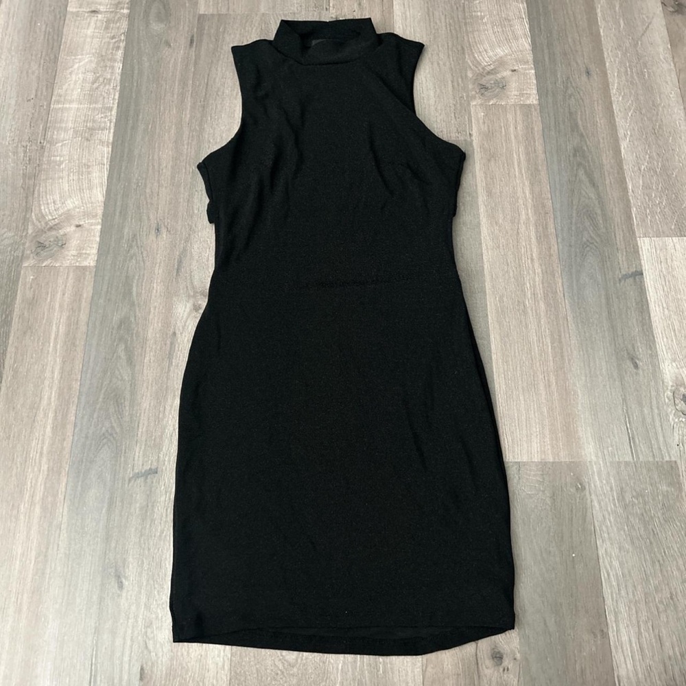 Backless mock neck mini dress. Slightly sparkly material.